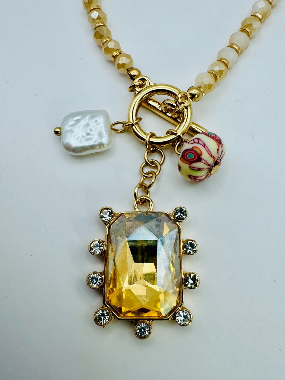 Gold and Cream Beaded Pendant Necklace with Champagne Crystal